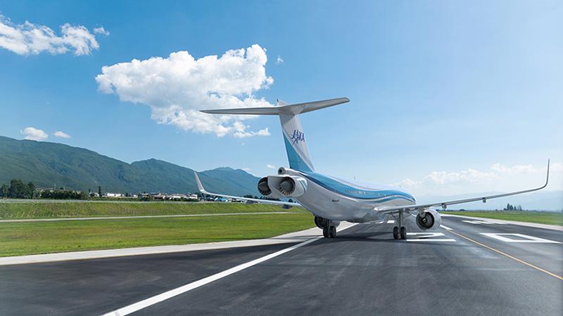 Rear view of JAXA aircraft on runway