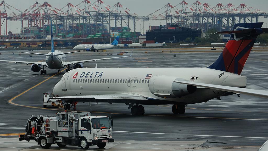 Delta Air Lines and other aircraft lining up at airport